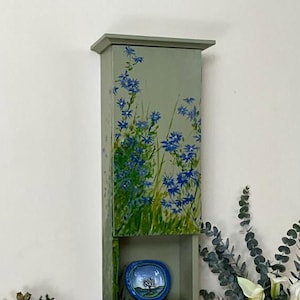 Handmade and hand painted wall cabinet in green with asters