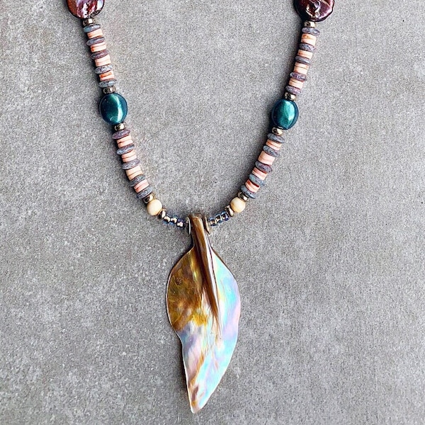 Leaf Pendant made of Shell hangs on strand of Purple and Aqua Mother of Pearl Discs, Bone Rounds, Coral Heishi, Blue Czech Glass & Silver