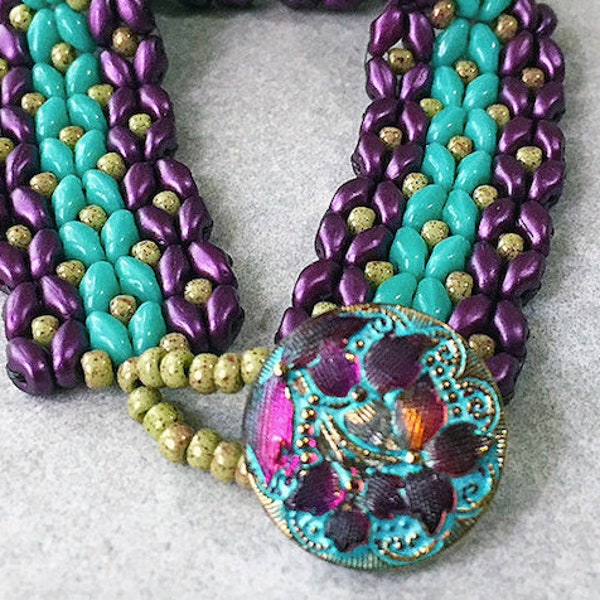 Matubo Vega on Chalk and Opaque Turquoise Duos are hand woven with gold Seed Beads and completed by Czech Glass Lacy Flower Design Button