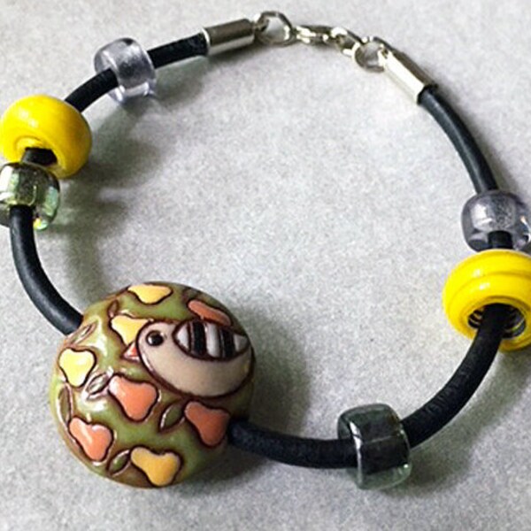 Stoneware Round Bead with Terracotta Partridge on Pear Tree Design slides on Black Leather Cord with assorted African Glass Beads