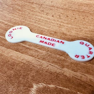 食料品カートのトークン - 25/1 または 1 ルーニー。No Frills およびカートを使用するための 25/1 トークンを持つ他のすべての店舗で使用できます。
