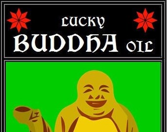 May include: A green background with a yellow smiling Buddha figure holding a small cup in its left hand. The text "lucky BUDDHA oil" is at the top of the image and "ARTE OBSCURA OCCULT • CURIO • BOTANICA" is at the bottom.