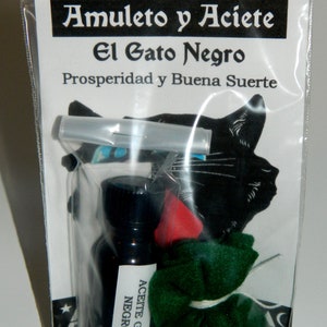 May include: A clear plastic bag containing a black and white image of a black cat, a small green pouch tied with white string, and a small glass bottle with a black label that reads "Aceite Gato Negro". The bag has a white label with the text "Amulet y Aceite El Gato Negro Prosperidad y Buena Suerte".