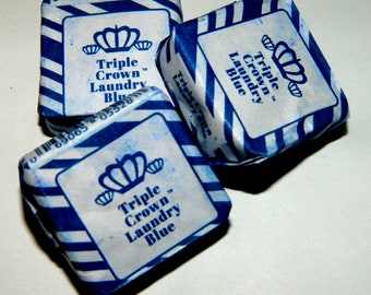 May include: Three blue and white packages of Triple Crown Laundry Blue. Each package has a white label with the brand name and a crown logo.