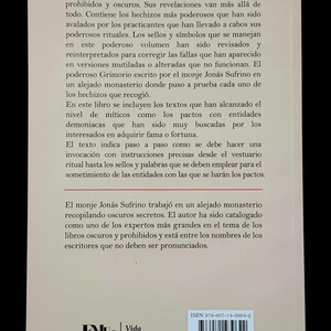 May include: A book with a white cover featuring Spanish text. The back cover includes text about forbidden books and rituals, with an ISBN bar code and the publisher's logo. The book's theme is related to the occult.