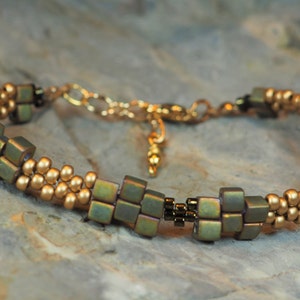 Bracelet Metallic Matte Green and Matte Gold Colors Cube Beads Hand Woven Adjustable Length