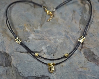 Choker – Two Strand Black Cord, Gold Color Metal Beads, Leaf Pendant, 15- 16" Length Adjustable (Item #: CH ME ME G 01)