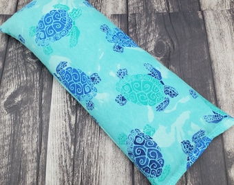 Microwave heat pad.  Sea turtle, microwave rice heating pad.  Reusable hot/cold pack.  Rice bag for heat therapy or cold pack.