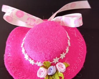 Bright pink hat. Ribbon roses and flowery bow trim. Fits Barbie, Skipper and similar size objects. Miniature decorative handmade headgear.