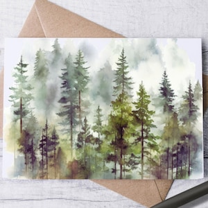 May include: A watercolor print of a forest scene featuring tall evergreen trees in shades of green, brown, and purple, with a misty, atmospheric effect. The artwork is on a white card, resting on a brown envelope, with a pen.