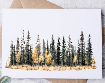 May include: A watercolor landscape art print featuring a forest scene with tall evergreen trees and golden-yellow deciduous trees. The artwork is on a white card, with a brown envelope behind it. Eucalyptus leaves are in the foreground.