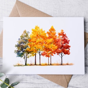 May include: A rectangular greeting card featuring a watercolor illustration of five trees in a row, transitioning in color from blue and green on the left to yellow, orange, and vibrant red on the right, set against a plain white background.