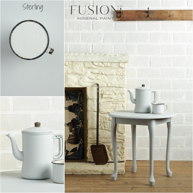 May include: A white brick wall with a fireplace and a small table with two white teapots and a white mug. The text "FUSION MINERAL PAINT" is visible above the fireplace. The paint color is called "Sterling."
