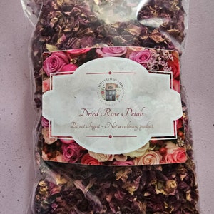 May include: A clear plastic bag filled with dried rose petals. The bag has a label that reads "Dried Rose Petals" and "Do not Ingest - Not a culinary product".