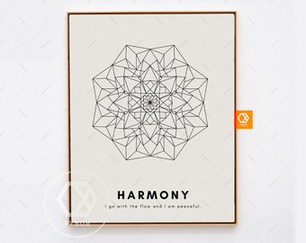 May include: A framed print featuring a geometric mandala design in black on a cream background. The word "HARMONY" is printed in a bold font below the mandala, with the phrase "I go with the flow and I am peaceful." below it. The frame is a light brown color.