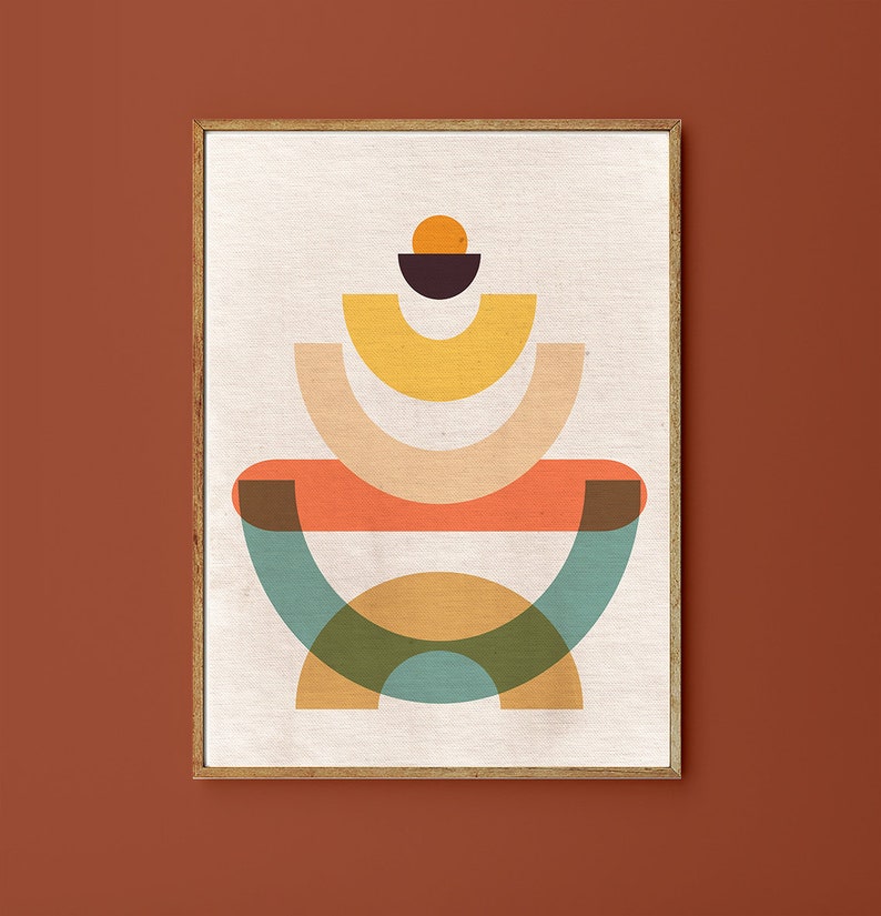 May include: Abstract geometric art print with a layered design of overlapping circles and semi-circles in shades of orange, yellow, green, blue, and brown. The print is framed in a light wood frame.