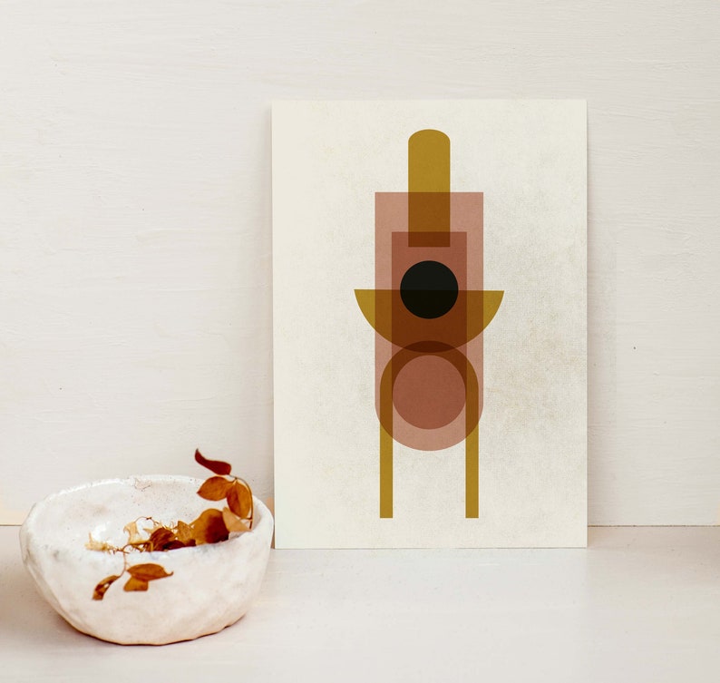 May include: Abstract geometric art print with overlapping shapes in shades of brown, gold, and black. The print features a circle, rectangle, and a tall, thin rectangle.