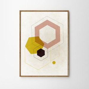 May include: Abstract geometric art print with overlapping hexagons in shades of pink, yellow, and black on a cream background. The print is framed in a light wood frame.