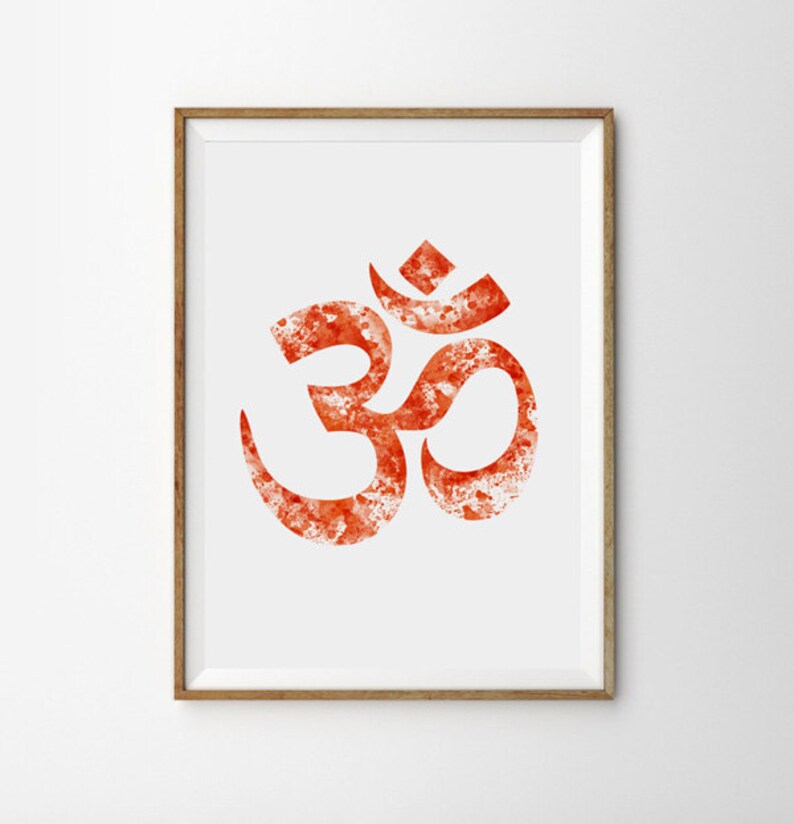 May include: A framed print of the Om symbol in a watercolor style. The symbol is a deep orange color with white accents and a white background.