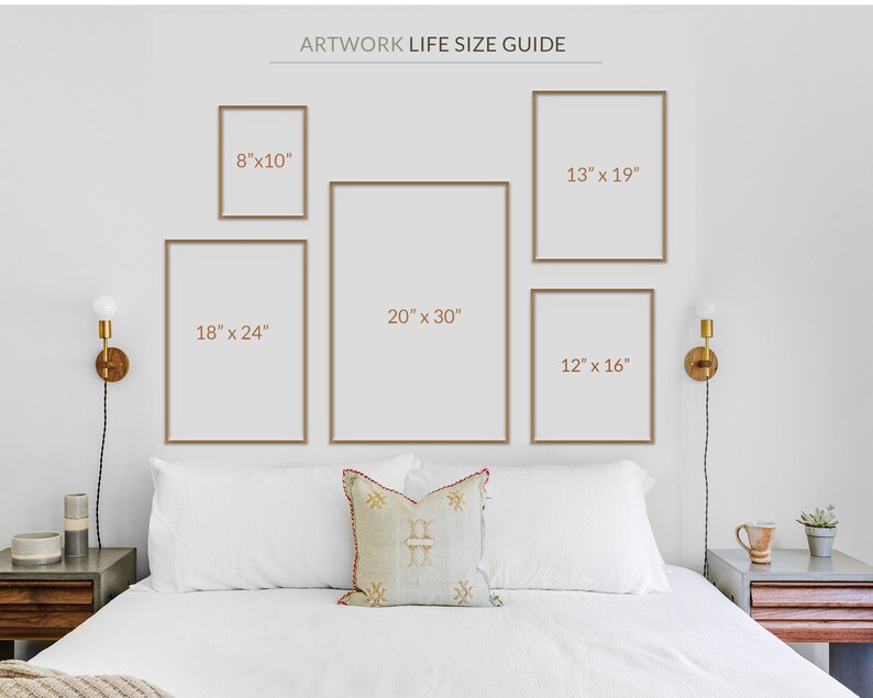 May include: A display of framed artwork in various sizes, including 8"x10", 12"x16", 13"x19", 18"x24", and 20"x30", against a white wall. The text "ARTWORK LIFE SIZE GUIDE" is at the top. The frames are a light brown color.