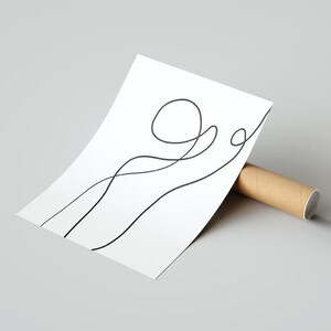 May include: A white print with a black line drawing of a simple abstract design. The design features a circle and a curved line.
