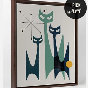 May include: A framed print of a mid-century modern abstract art design featuring three stylized cats in shades of blue and green against a light gray background. A yellow circle is in the lower right corner of the print.