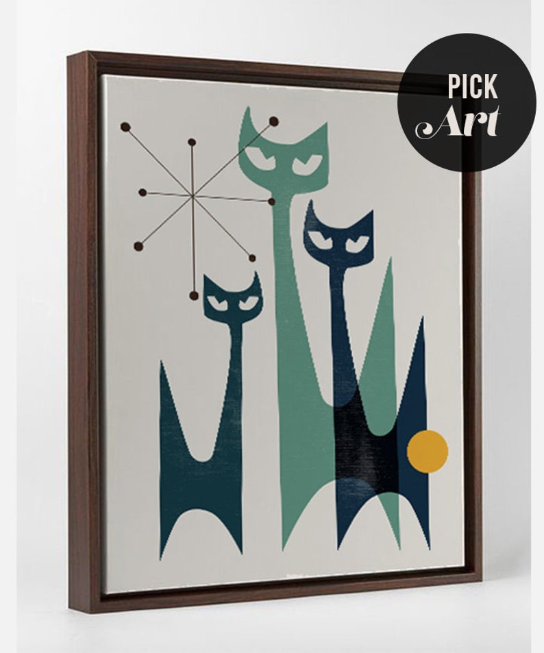 May include: A framed print of a mid-century modern abstract art design featuring three stylized cats in shades of blue and green against a light gray background. A yellow circle is in the lower right corner of the print.