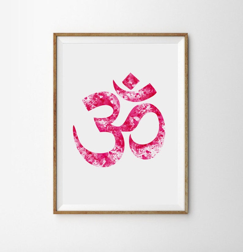 May include: A framed print of a pink watercolor Om symbol, a sacred sound in Hinduism and Buddhism, representing the universe and the divine.