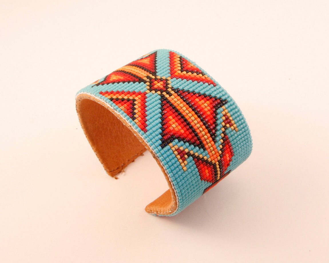 Beaded Geometric Design Bracelet in Reds and Gold on a Etsy