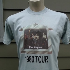 Size ML (44) ** Old Stock Dated 1980 The Eagles Shirt (Single Stitch) (Screen Stars) (Single Sided) (C) Licensed by Roach 1979
