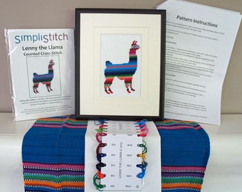 May include: A counted cross stitch kit featuring a llama with colorful stripes. The kit includes a pattern, embroidery floss, and Aida cloth. The pattern is titled "Lenny the Llama" and is copyrighted 2013.