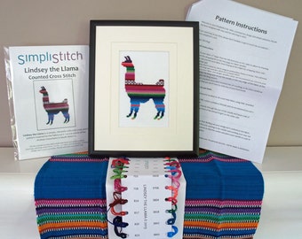 May include: A counted cross stitch kit featuring a colorful llama design. The kit includes a pattern, embroidery floss, and a needle. The pattern is called "Lindsey the Llama" and is a counted cross stitch pattern.