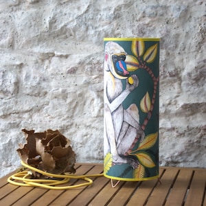 Table lamp with conical shade, Cole and Son Baboon wallpaper.