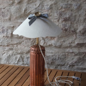 Antique copper bouillotte table lamp with white linen scalloped lampshade. Unique piece.