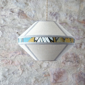 "Saucer" lampshade suspension, beige banana fiber fabric and wallpaper.