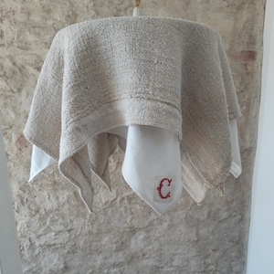 Rustic hemp and monogrammed cotton light pendant.