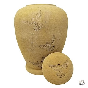 May include: A beige ceramic urn with a lid. The urn has a textured surface and a design of stylised birds.