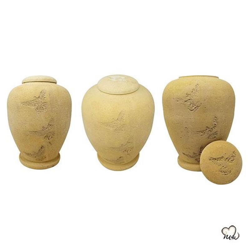 May include: Three beige ceramic urns with a textured surface and a subtle pattern. The urns have lids and are ideal for storing ashes or other small items.