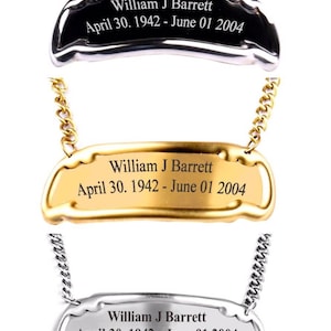 May include: Three silver bottle stoppers with chains. Each stopper has a black, gold, or silver finish and is engraved with the text "William J Barrett April 30. 1942 - June 01 2004".