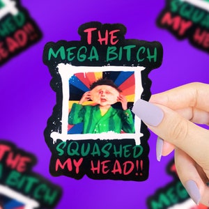 Puede incluir: Una pegatina en blanco y negro con un fondo de arcoíris colorido. La pegatina presenta un personaje de dibujos animados con una cabeza de sandía verde y el texto "The Mega Bitch Squashed My Head!"