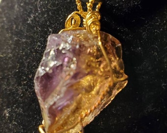 Ametrine crystal pendant in a miminalistic Pecora wire wrap.