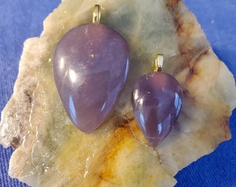 For Valentines Day partners pendants being sold as a set. Hand crafted cabachons from beautiful purple Calcodney.
