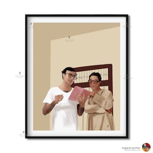 May include: Two men wearing glasses are standing in a room with a wooden door. One man is wearing a white shirt and the other is wearing a beige shirt. They are both looking at a pink book.