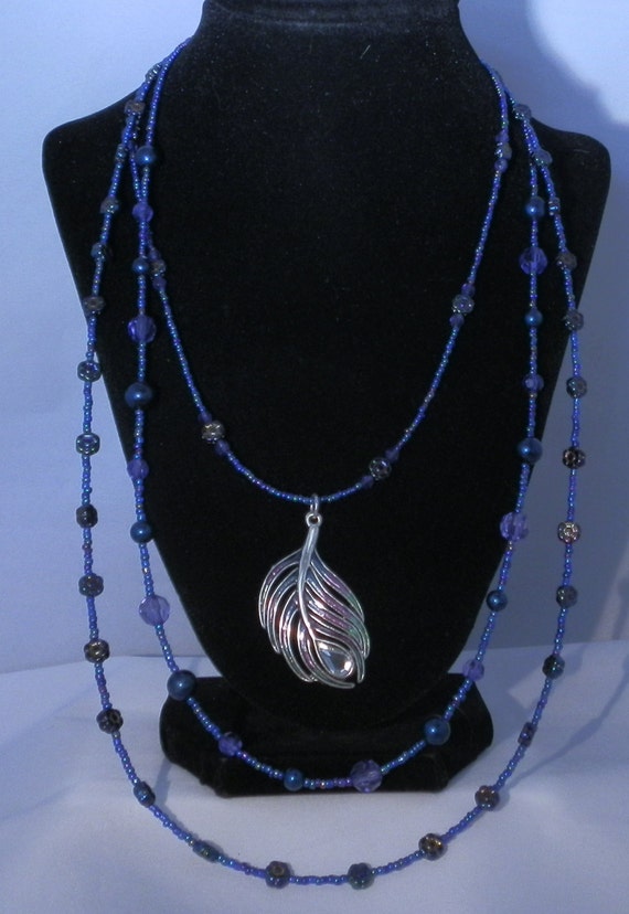 Items similar to Triple strand beaded necklace with peacock focal on Etsy