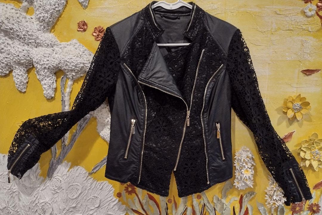 Black jacket gold zipper Zipper on pockets gold zipper in front Nylan black lace Size M Gold zipper on caller unique