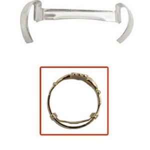 May include: A gold ring size adjuster with a spring mechanism. The adjuster is designed to fit over the band of a ring to make it larger.