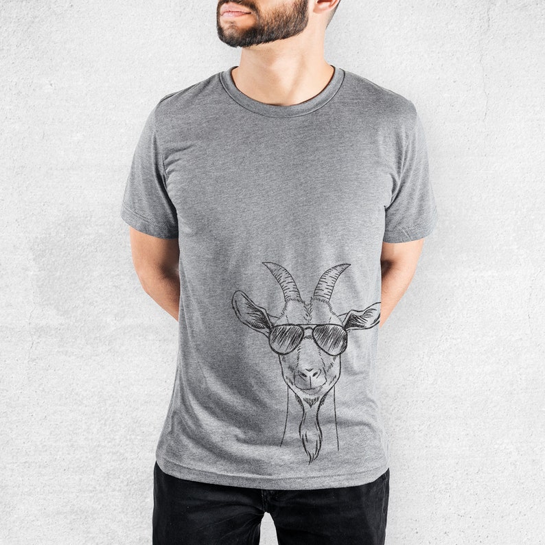 May include: A heather grey t-shirt featuring a black and white illustration of a goat wearing sunglasses.