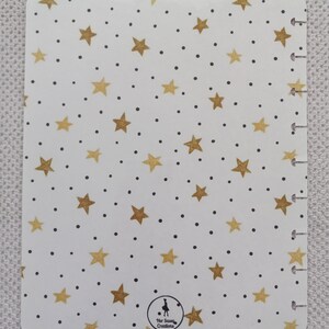 May include: White planner cover with a gold star and black dot pattern. The cover has a gold logo that says "Her Sassy Creations".