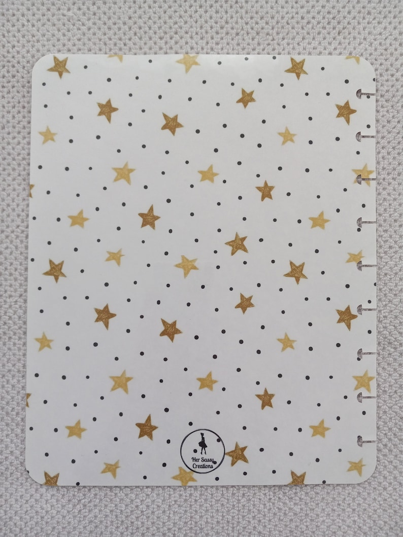 May include: White planner cover with a gold star and black dot pattern. The cover has a gold logo that says "Her Sassy Creations".