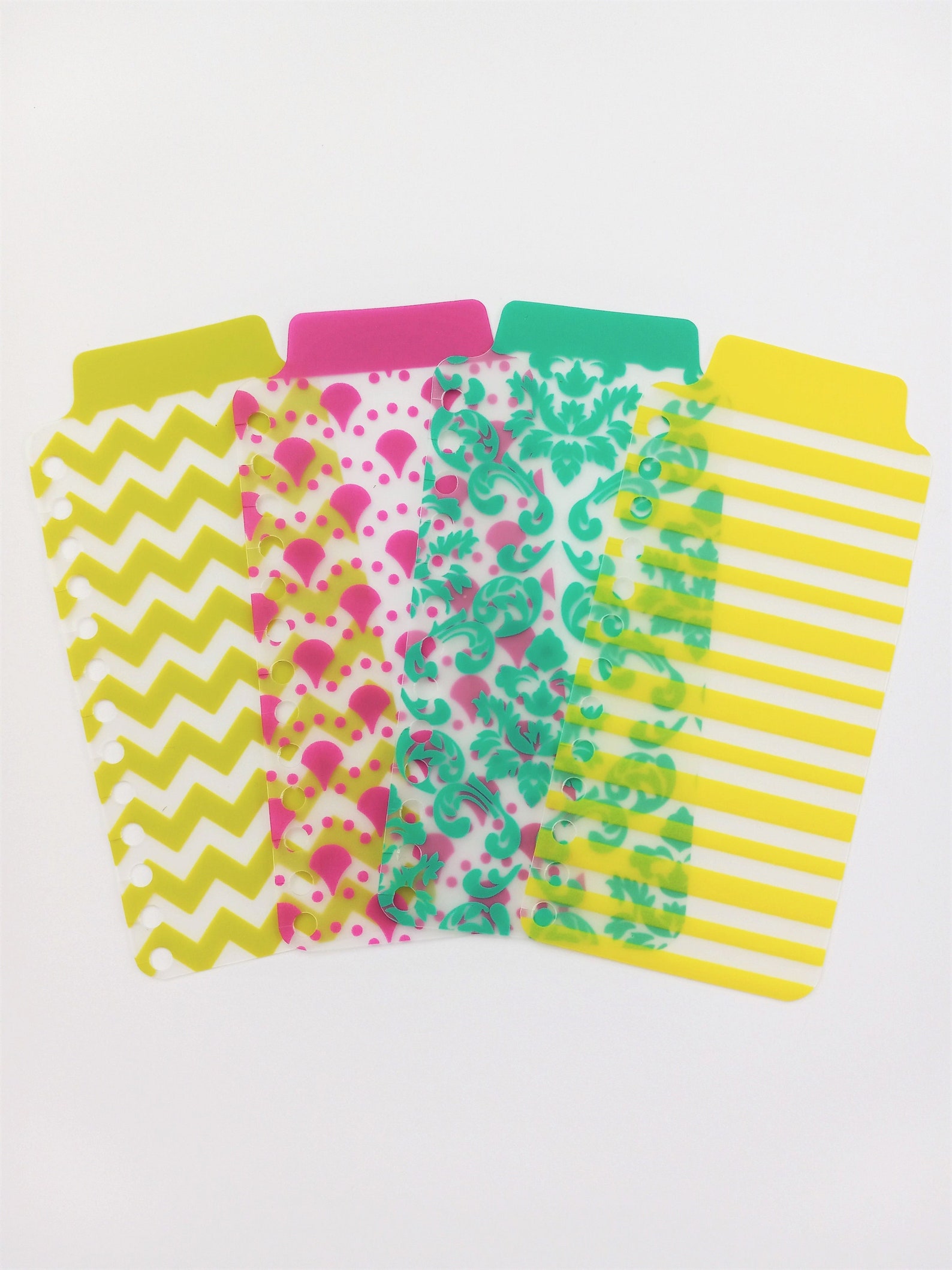 A photo of four large brightly colored patterned tabs with tons of space for writing.